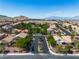 Aerial view showcases a well-maintained community with lush greenery at 4016 Owlshead Mountain St, Las Vegas, NV 89129