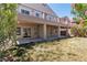 The home's rear exterior features a covered patio on both levels, offering backyard access at 4016 Owlshead Mountain St, Las Vegas, NV 89129