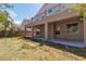 The home's back exterior boasts dual covered patios that provide backyard access at 4016 Owlshead Mountain St, Las Vegas, NV 89129
