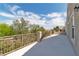 Open balcony with wrought iron railing showing the property and surrounding neighborhood at 4016 Owlshead Mountain St, Las Vegas, NV 89129