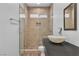 Stylish bathroom featuring a glass-enclosed shower and floating vanity at 4016 Owlshead Mountain St, Las Vegas, NV 89129