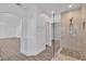 Spacious bathroom featuring large tile shower with glass enclosure and open doorway at 4016 Owlshead Mountain St, Las Vegas, NV 89129