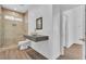 Modern bathroom featuring a glass-enclosed shower and floating vanity at 4016 Owlshead Mountain St, Las Vegas, NV 89129