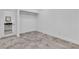 This bedroom features modern floors, neutral walls, a closet, and open view of the on-suite bathroom at 4016 Owlshead Mountain St, Las Vegas, NV 89129