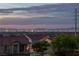 Sunset view of the Las Vegas skyline, mountains, and nearby community homes at 4016 Owlshead Mountain St, Las Vegas, NV 89129