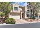 Inviting two-story home with a two-car garage, tile roof, and well-maintained landscaping at 4016 Owlshead Mountain St, Las Vegas, NV 89129