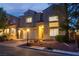 Charming two-story home with a well-manicured lawn, a welcoming entrance, and a two-car garage at 4016 Owlshead Mountain St, Las Vegas, NV 89129