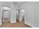 Bright hallway with wood-look floors and neutral paint leads to various rooms at 4016 Owlshead Mountain St, Las Vegas, NV 89129