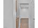 Bright hallway leads to other rooms with wood-look floors and neutral paint at 4016 Owlshead Mountain St, Las Vegas, NV 89129