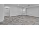 Spacious living area with stone tile flooring and neutral decor, ideal for entertaining or relaxing at 4016 Owlshead Mountain St, Las Vegas, NV 89129