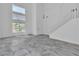 Bright living room featuring soaring ceilings, tile floors, and abundant natural light at 4016 Owlshead Mountain St, Las Vegas, NV 89129