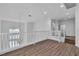 Spacious loft area with modern railing, wood floors, natural light, and overlooking downstairs area at 4016 Owlshead Mountain St, Las Vegas, NV 89129
