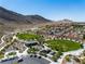 Overhead view of Trigono Hills Park, showing expansive green spaces, playgrounds, and walking trails at 4016 Owlshead Mountain St, Las Vegas, NV 89129