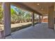 A covered patio provides shade, enhancing views of the drought-resistant backyard landscaping at 4016 Owlshead Mountain St, Las Vegas, NV 89129