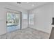Bright sunroom with stone tile flooring, sliding glass doors, and access to outdoor space at 4016 Owlshead Mountain St, Las Vegas, NV 89129
