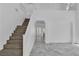 Elegant staircase with wood treads and white risers leading to the upper level at 4016 Owlshead Mountain St, Las Vegas, NV 89129