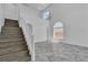 Open staircase with views to the living area below, showcasing natural light at 4016 Owlshead Mountain St, Las Vegas, NV 89129