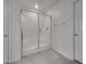 Walk-in shower features a tiled surround, glass door and chrome fixtures at 4448 Mahogany Hills Ave, Las Vegas, NV 89141