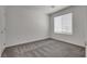 Comfortable bedroom with a large window and plush carpeting at 4448 Mahogany Hills Ave, Las Vegas, NV 89141