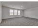 Large, carpeted bedroom with three windows offering natural light at 4448 Mahogany Hills Ave, Las Vegas, NV 89141