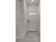 White door and tile entryway with minimalist design and neutral tones at 4448 Mahogany Hills Ave, Las Vegas, NV 89141