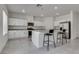 Bright kitchen featuring granite countertops, island seating, and stainless steel appliances at 4448 Mahogany Hills Ave, Las Vegas, NV 89141