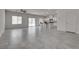 Open-concept living area with white walls and access to the kitchen at 4448 Mahogany Hills Ave, Las Vegas, NV 89141