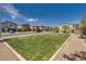 A beautiful view of the street lined with sidewalks, green space, trees, and houses at 4448 Mahogany Hills Ave, Las Vegas, NV 89141