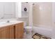 Well-kept bathroom featuring a vanity, toilet, and shower with nature themed rug at 4970 Black Bear Rd # 101, Las Vegas, NV 89149