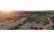 An aerial view shows the beautifully maintained golf course, desert landscaping, and mature trees throughout at 4970 Black Bear Rd # 101, Las Vegas, NV 89149