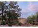 Picturesque entrance to Painted Desert, showcasing lush landscaping and community pride at 4970 Black Bear Rd # 101, Las Vegas, NV 89149