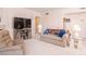 Bright and airy living room with fireplace, TV, and ample seating at 4970 Black Bear Rd # 101, Las Vegas, NV 89149
