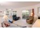Relaxing living room with a door to the balcony, enhancing the inviting open floor plan at 4970 Black Bear Rd # 101, Las Vegas, NV 89149