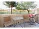 Cozy outdoor patio with a table, chairs, and grill, perfect for relaxing outside at 4970 Black Bear Rd # 101, Las Vegas, NV 89149