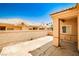 View of the property's rear patio with neutral stucco walls and a clear sky overhead at 5316 Fieldstone Rd, Las Vegas, NV 89107