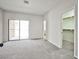 Open bedroom featuring carpet, sliding door access to patio and walk-in closet at 5316 Fieldstone Rd, Las Vegas, NV 89107