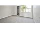 Bedroom featuring neutral paint and carpet with window and view into walk-in closet at 5316 Fieldstone Rd, Las Vegas, NV 89107