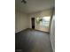 Bedroom featuring neutral carpet, a window, and access to a walk-in closet at 5316 Fieldstone Rd, Las Vegas, NV 89107