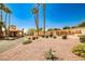 Community entrance featuring manicured landscaping, gravel, and the 'Promenade at the Meadows' sign at 5316 Fieldstone Rd, Las Vegas, NV 89107