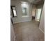 Hallway with tile flooring, access to bedrooms, and a built-in mirror niche at 5316 Fieldstone Rd, Las Vegas, NV 89107
