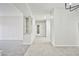 Hallway view featuring tile flooring, neutral walls, and access to various rooms at 5316 Fieldstone Rd, Las Vegas, NV 89107