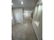 An open hallway features tile flooring, neutral paint, and great lighting at 5316 Fieldstone Rd, Las Vegas, NV 89107