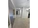 Hallway features tile flooring, a built in cabinet, and neutral paint at 5316 Fieldstone Rd, Las Vegas, NV 89107
