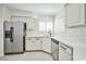 Well-lit kitchen with stainless steel appliances, white cabinets, and ample counter space at 5316 Fieldstone Rd, Las Vegas, NV 89107