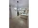 Tile flooring, stainless appliances, white cabinets, and an eat-in counter make this kitchen desirable at 5316 Fieldstone Rd, Las Vegas, NV 89107