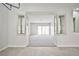 Bright living room featuring carpet, views to the backyard, and neutral wall color at 5316 Fieldstone Rd, Las Vegas, NV 89107