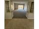A spacious living room with built-in cabinets, neutral colors, and sliding glass doors for ample light at 5316 Fieldstone Rd, Las Vegas, NV 89107