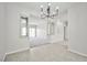 Living room with carpet, modern lighting, and views to another room at 5316 Fieldstone Rd, Las Vegas, NV 89107