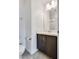 Ensuite bathroom with a vanity, white sink, chrome finishes, and ample lighting at 538 Ylang Pl, Henderson, NV 89015