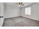 Spacious bedroom with a ceiling fan, window with blinds, and neutral carpet at 538 Ylang Pl, Henderson, NV 89015